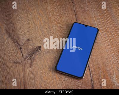 Lod, Israel - July 16,2023: Pango app launch screen on smartphone on wooden background. Top view flat lay with copy space. Stock Photo