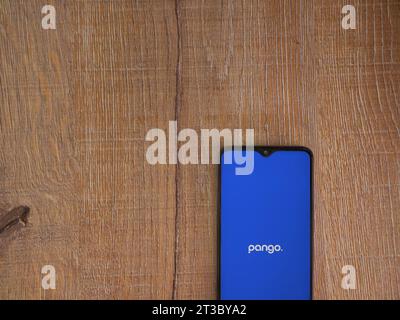 Lod, Israel - July 16,2023: Pango app launch screen on smartphone on wooden background. Top view flat lay with copy space. Stock Photo