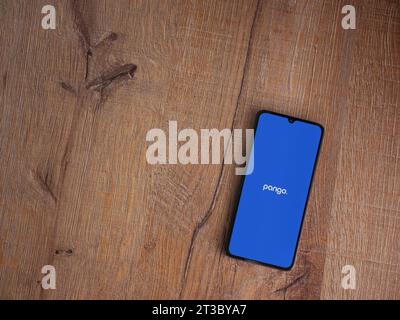 Lod, Israel - July 16,2023: Pango app launch screen on smartphone on wooden background. Top view flat lay with copy space. Stock Photo