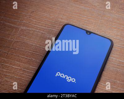 Lod, Israel - July 16,2023: Pango app launch screen on smartphone on wooden background. Top view flat lay with copy space. Stock Photo