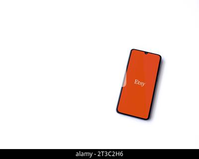 Lod, Israel - July 16,2023: Etsy app launch screen on smartphone on white background. Top view flat lay with copy space. Stock Photo