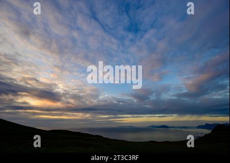 Sunset clouds over the sea and coast from Runde Island, Norway Stock Photo