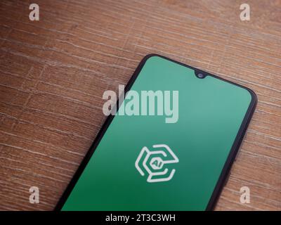 Lod, Israel - July 16,2023: Adam Ai app launch screen on smartphone on wooden background. Top view flat lay with copy space. Stock Photo