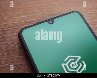 Lod, Israel - July 16,2023: Adam Ai app launch screen on smartphone on wooden background. Top view flat lay with copy space. Stock Photo
