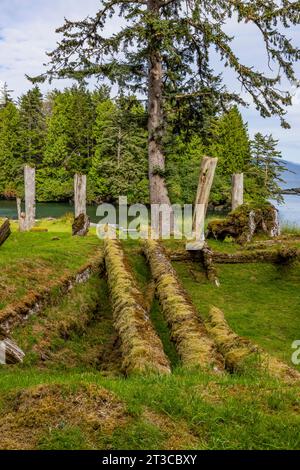 Remains of longhouse at UNESCO World Heritage Site Sgang Gwaay Llnagaay, an ancient village site in Gwaii Haanas National Park Reserve, Haida Gwaii, B Stock Photo