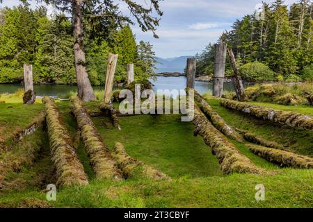 Remains of longhouse at UNESCO World Heritage Site Sgang Gwaay Llnagaay, an ancient village site in Gwaii Haanas National Park Reserve, Haida Gwaii, B Stock Photo