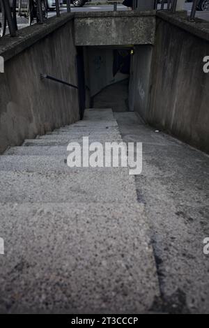 Staircase  of an underground passage in a residential area of an italian town at sunset Stock Photo