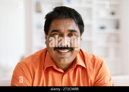 Closeup portrait of mature indian man posing at home Stock Photo