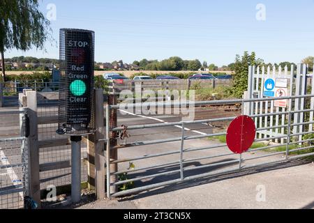 User-operated railway level crossing with lights, Warrington, Cheshire Stock Photo