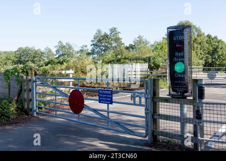 User-operated railway level crossing with lights, Warrington, Cheshire Stock Photo