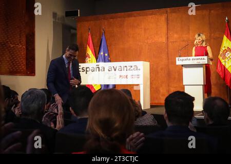 Pedro Sanchez, leader of the socialist party and current acting president of the Spanish government, greets those present while Yolanda Diaz, leader of SUMAR and current acting vice president of the government of Spain, addresses those present during the event at the Reina Sofía museum. The Spanish socialist workers' party (PSOE) and the coalition of left-wing parties Sumar have closed an agreement for a new coalition government. Pedro Sanchez, leader of the socialist party and current acting president of the Spanish government, and Yolanda Diaz, leader of SUMAR and current acting vice preside Stock Photo