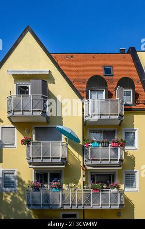 Yellow facade with green balconies, Kempten, Allgaeu, Bavaria, Germany Stock Photo