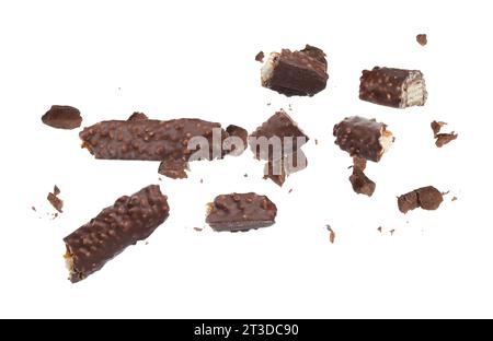 Pieces of tasty chocolate bars falling on white background Stock Photo