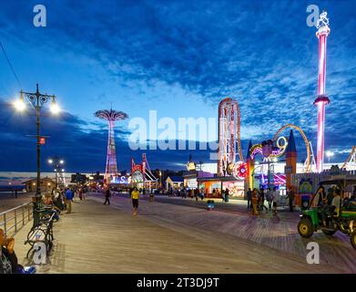 Riegelmann Boardwalk, a NYC scenic landmark, is a wood and concrete promenade stretching the length of Coney Island and Brighton Beach. Stock Photo