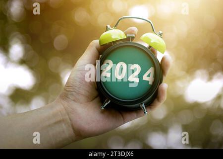 Human Hand Holding Clock 2024 Happy New Year 2024 Stock Photo Alamy   Human Hand Holding Clock 2024 Happy New Year 2024 2t3djx6 