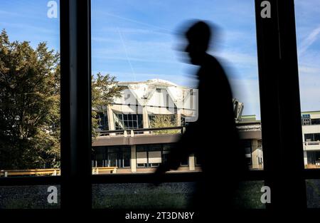 Bochum, Germany. 10th Oct, 2023. ILLUSTRATION: A man walks through the corridors of the Humanities building at the Ruhr University in Bochum. According to research by the legend researcher D. Sondermann, the building is said to be haunted. The 'Eternal Student' is haunting the brittle concrete architecture. (To dpa: 'The Eternal Student' of Bochum') Credit: Oliver Berg/dpa/Alamy Live News Stock Photo