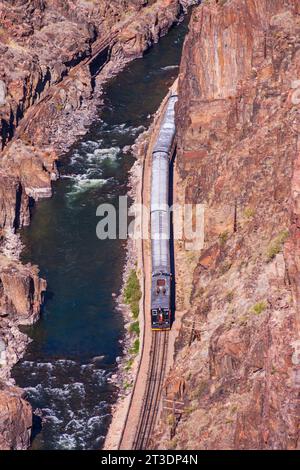 Royal Gorge Route Railroad, a heritage railroad, viewed from the Royal Gorge Suspension Bridge. This vintage train provides a two hour ride. Stock Photo