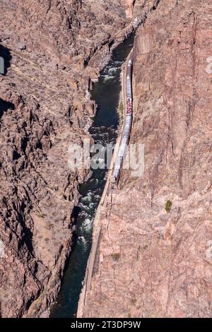 Royal Gorge Route Railroad, a heritage railroad, viewed from the Royal Gorge Suspension Bridge. This vintage train provides a two hour ride. Stock Photo