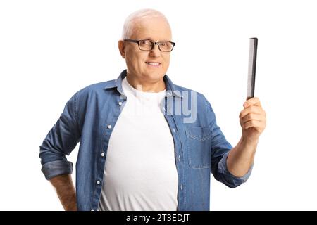 Mature man with white hair holding a hair comb isolated on white background Stock Photo