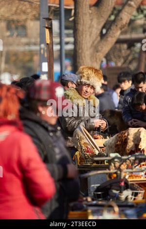 A Chinese Market Trader In The 798 Art Zone (Dashanzi Art District), Beijing, China. Stock Photo