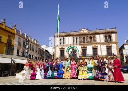 Spain, Andalusia, Province of Malaga, Ronda: group of Sevillian flamenco dancers of all ages with traditional costumes and colorful dresses with ruffl Stock Photo