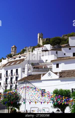 Spain, Andalusia, Province of Malaga, Casares: the central square with multicolored flags for the celebration of the “Virgen del Rosario, del Campo (O Stock Photo