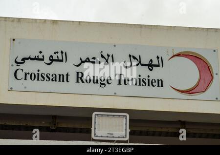 October 24, 2023: Tunis, Tunisia. 24 October 2023. The logo of the Tunisian Red Crescent. Supplies of humanitarian aid for Gaza are being prepared by the organisation in its headquarters in Tunis. The humanitarian situation has constantly deteriorated in Gaza since Israeli forces began bombarding the Palestinian enclave after Hamas operation in Israel on October 7th (Credit Image: © Hasan Mrad/IMAGESLIVE via ZUMA Press Wire) EDITORIAL USAGE ONLY! Not for Commercial USAGE! Stock Photo