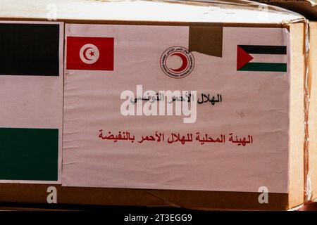 October 24, 2023: Tunis, Tunisia. 24 October 2023. Cardboard boxes are filled with supplies of humanitarian aid for Gaza at the headquarters of the Tunisian Red Crescent in Tunis. The humanitarian situation has drastically deteriorated in Gaza since Israeli forces began bombarding the Palestinian enclave after Hamas operation in Israel on October 7th (Credit Image: © Hasan Mrad/IMAGESLIVE via ZUMA Press Wire) EDITORIAL USAGE ONLY! Not for Commercial USAGE! Stock Photo