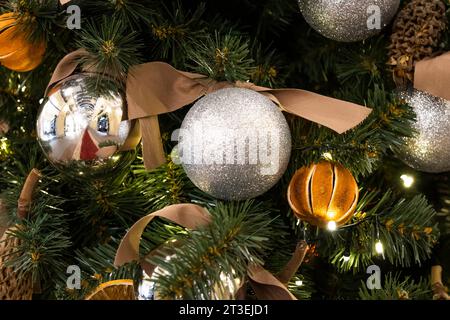 Golden ball, Christmas decorations and toys on the Christmas tree Stock Photo