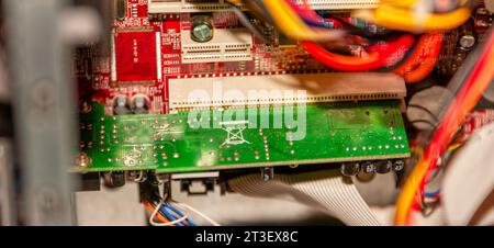computer repairs, internal components on the motherboard, pci slot with network card Stock Photo