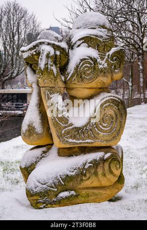 Stone sculpture as Maori under the snow in Leiden, Netherlands, cultural heritage Stock Photo