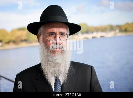 Hamburg, Germany. 25th Oct, 2023. Hamburg's State Rabbi Shlomo Bistritzky stands on the sidelines of the laying of a Stolperstein on the Binnenalster. Credit: Christian Charisius/dpa/Alamy Live News Stock Photo