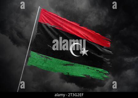 Libya torn flag on dark sky background with blood stains Stock Photo ...
