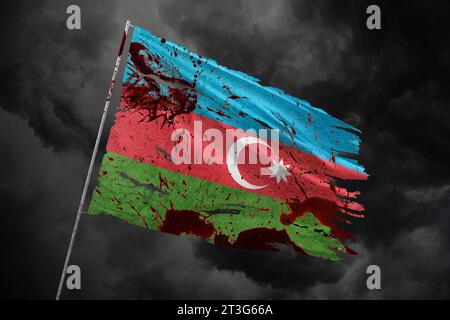 Azerbaijan torn flag on dark sky background with blood stains. Stock Photo