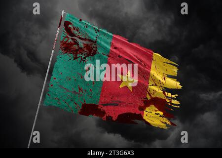 Cameroon torn flag on dark sky background with blood stains. Stock Photo