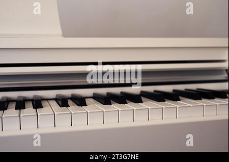 Elegance upright piano. Classic piano keyboard with black and white keys. Musical image Stock Photo