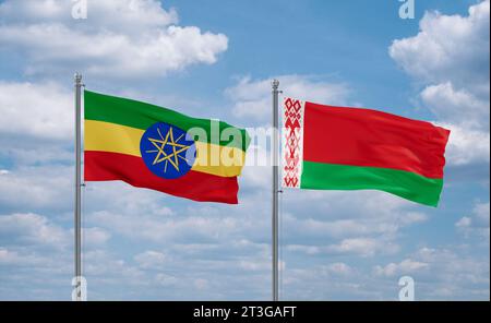 Ethiopia and Belarus flags waving together on blue cloudy sky, two ...