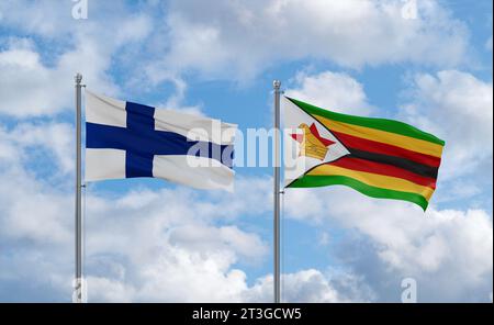 Finland and Zimbabwe flags waving together on blue cloudy sky, two ...