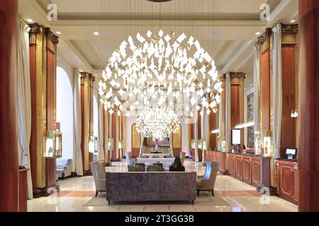 France, Alpes Maritimes, Cannes, La Croisette, Hotel Majestic Barriere in Art Deco style opened in 1923, lobby with its contemporary pendant light Stock Photo
