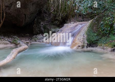 A long exposure shot of a creek flowing down the Vall d'Ora valley. Stock Photo