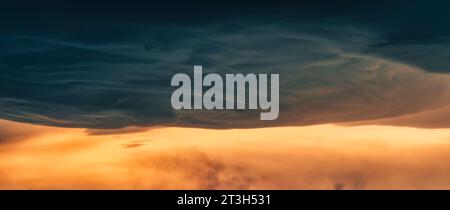Dramatic cloudscape asperitas cloud and dark sunset sky formation Stock Photo