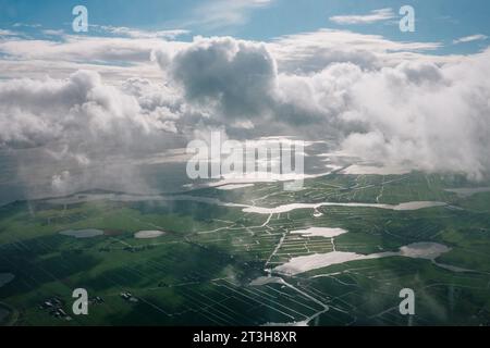 Small villages and farmland criss-crossed by canals, on the outskirts of Amsterdam, Netherlands Stock Photo