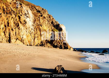Dume Cove Malibu, Zuma Beach, emerald and blue water in a quite paradise beach surrounded by cliffs. High quality photo Stock Photo