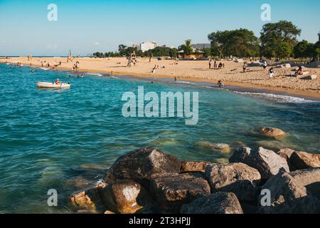 locals take a dip on a summer's day at Oakwood Beach on Lake Michigan, Chicago, United States Stock Photo