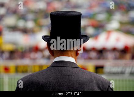 Senior man wearing a traditional black silk top hat and grey morning suit. Epsom Derby horse race. Epsom Downs, Surrey, England June 1995 1990s UK HOMER SYKES Stock Photo