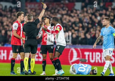 Rotterdam, Netherlands. 25th Oct, 2023. ROTTERDAM, NETHERLANDS - OCTOBER 25: Marcos Lopez of Feyenoord receives a yellow card by referee Tobias Stieler during the Group E - UEFA Champions League 2023/24 match between Feyenoord and SS Lazio at Stadion Feijenoord on October 25, 2023 in Rotterdam, Netherlands. (Photo by Andre Weening/Orange Pictures) Credit: Orange Pics BV/Alamy Live News Stock Photo