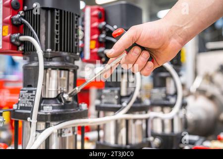 Montage Engineer Testing equipment with right hand no face. High quality photo Stock Photo