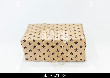 packages wrapped in brown paper with stars Stock Photo