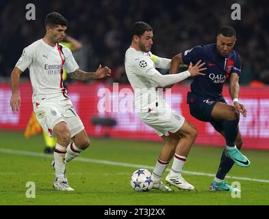PSG's Kylian Mbappe in action against AC Milan's Davide Calabria (centre) and AC Milan's Christian Pulisic during the UEFA Champions League Group F match at Parc des Princes in Paris, France. Picture date: Wednesday October 25, 2023. Stock Photo