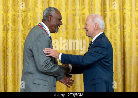 Washington, United States. 24 October, 2023. U.S President Joe Biden, right, congratulates Gebisa Ejeta after awarding him the National Medal of Science during a ceremony in the East Room of the White House, October 24, 2023 in Washington, D.C.  Credit: Adam Schultz/White House Photo/Alamy Live News Stock Photo